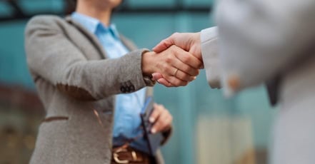 Image of a sales rep closing the sale on a cold call