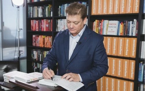 Image of bestselling author Jeb Blount signing Fanatical Prospecting