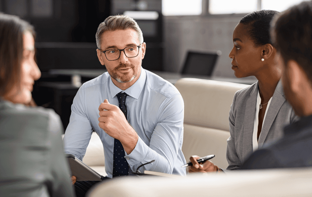 Sales Leader effectively leading a group of sales professionals after receiving Elite Sales Leadership coaching from Sales Gravy.