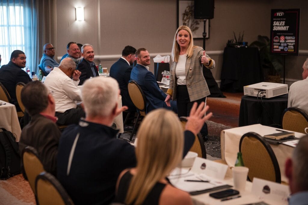 Master Senior Sales Trainer Sarah Greer leading a training with a group of sales professionals using Jeb Blount's Fanatical Prospecting Framework