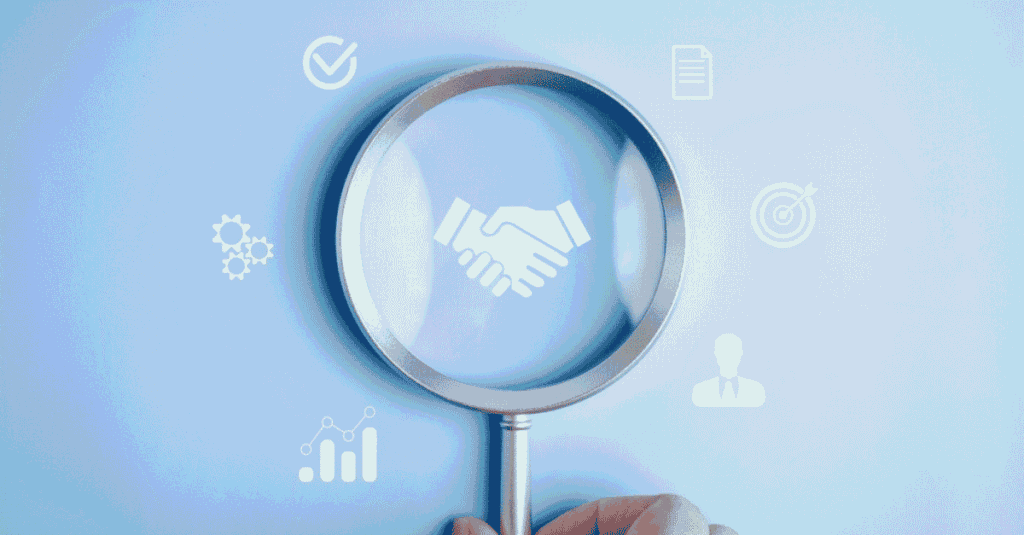 Magnifying glass over a handshake icon, illustrating how to negotiate in sales