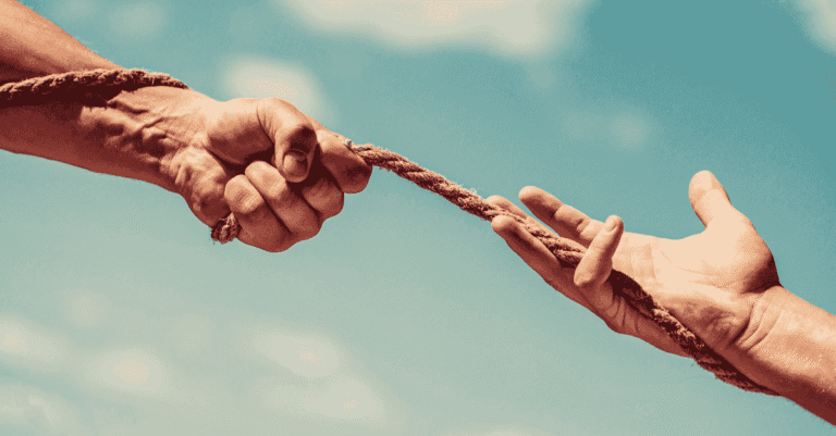 Sales manager resisting the urge to step in while a rep works a deal, illustrating why sales managers shouldn't rescue deals