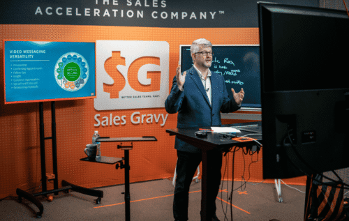 Trainer delivering a professional virtual training session with proper lighting and camera setup — free production checklist from Sales Gravy