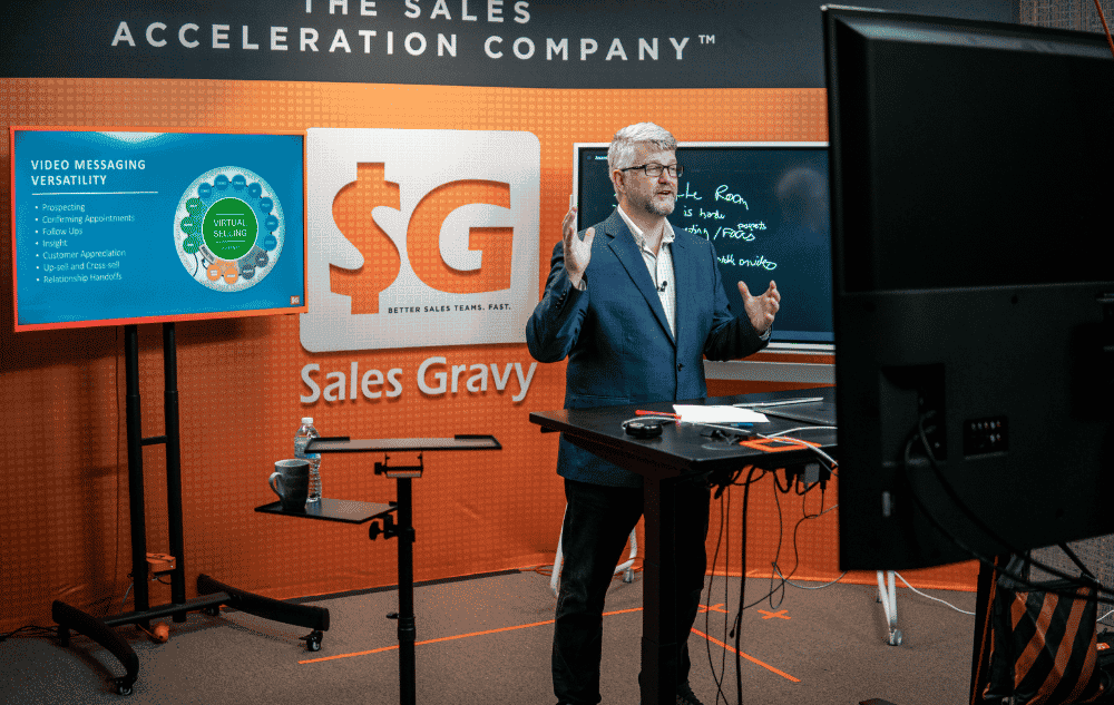 Trainer delivering a professional virtual training session with proper lighting and camera setup — free production checklist from Sales Gravy